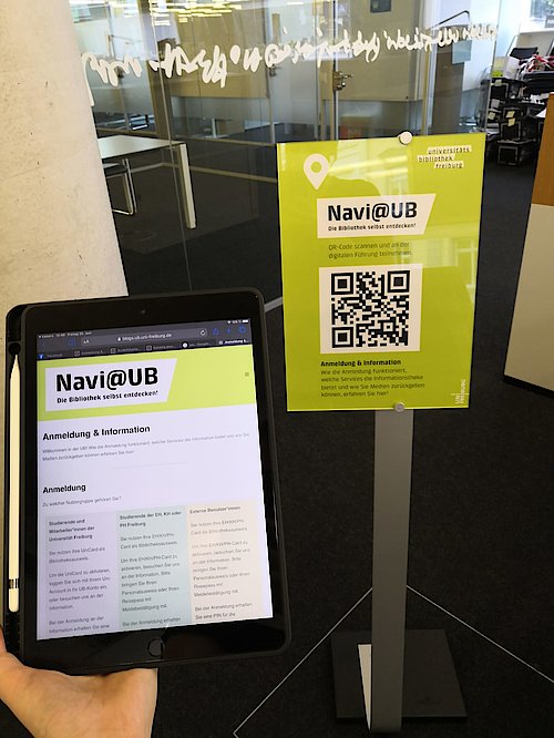 Navi@UB Plakat und Tablet vor Ort in der UB